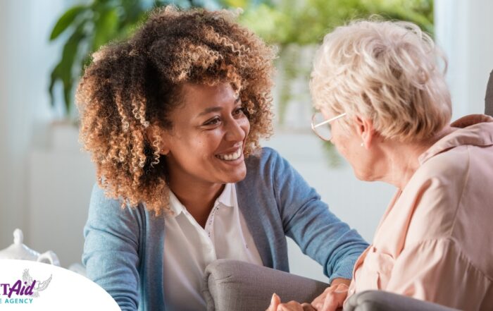 A caregiver warmly speaks with an older client, representing the quality communication that can come with bilingual care.