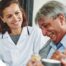 A woman smiles while with clients showing how you can enjoy senior caregiver jobs.