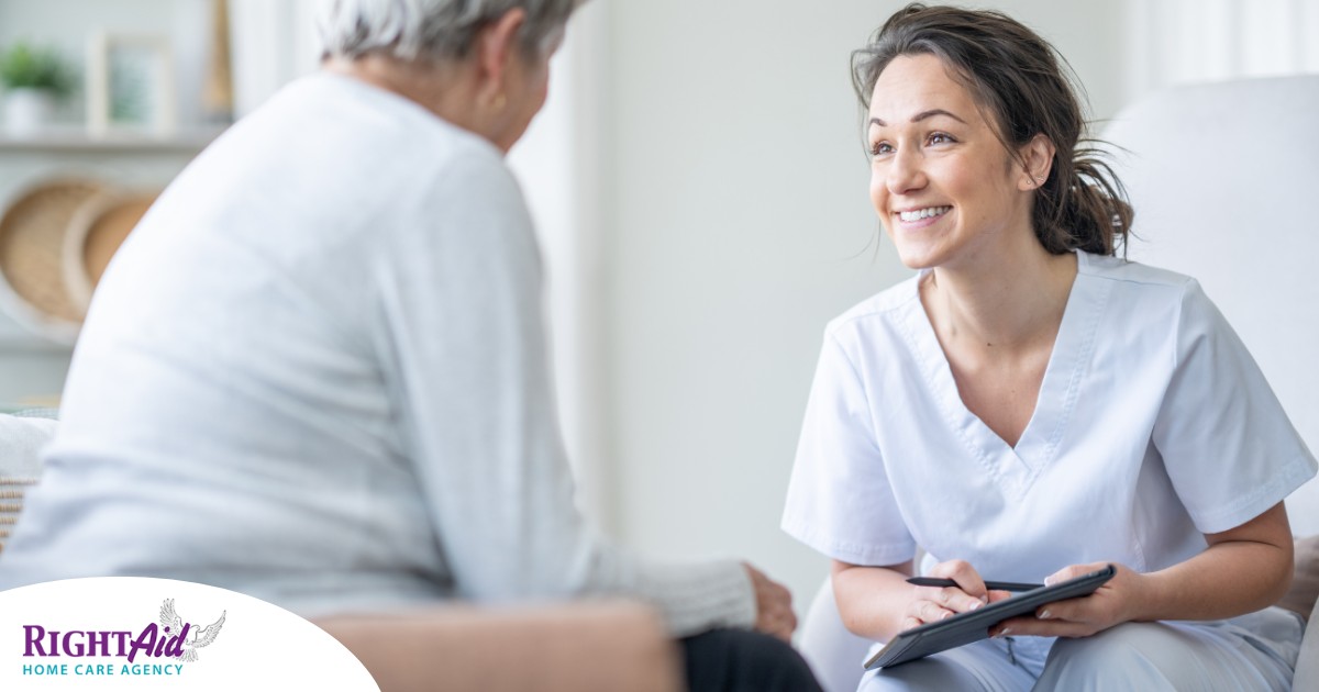 A woman smiles while with a client representing the pros of the home care industry.
