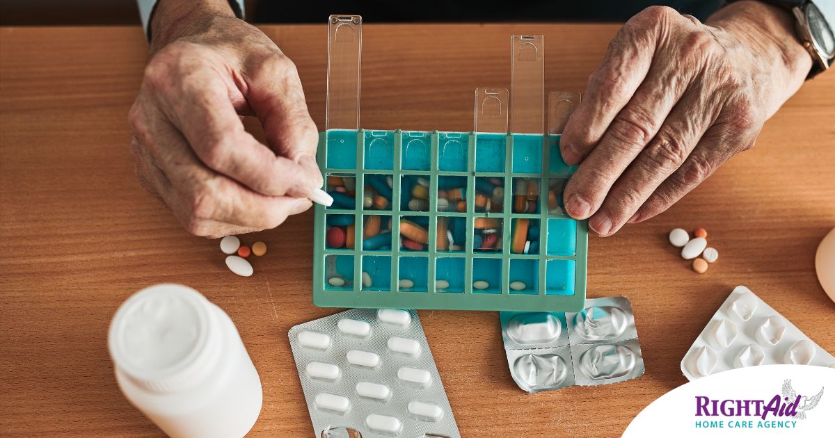 Older hands organize pills into a pill organizer, showing a great tool for managing medications.