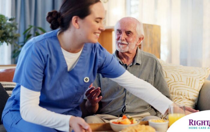 Caregiver providing senior care at home to manage parkinson’s and related symptoms.